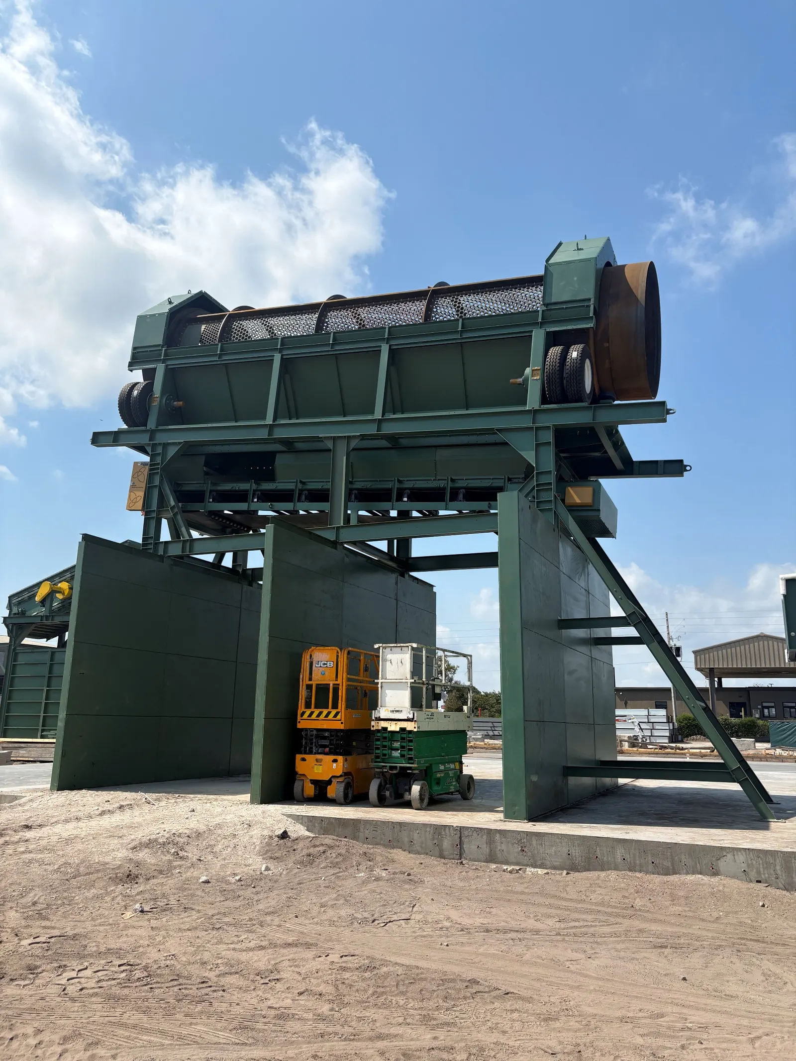 Trommel screen mounted on bunker walls at an outdoor installation